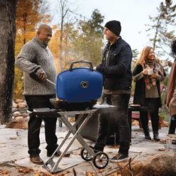 Napoleon TQ285X-RD-1-A TravelQ 285 Portable Grill With Scissor Cart, Propane 9 Napoleon TQ285X-RD-1-A TravelQ 285 Portable Grill With Scissor Cart, Propane -Kitchen Grill Shop tq285x muskoka lifestyle people grilling bl